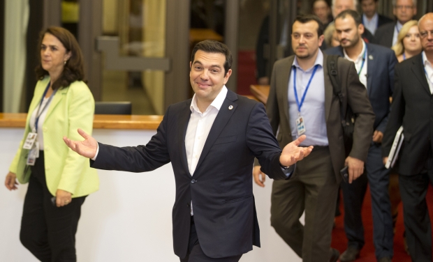 Greek Prime Minister Alexis Tsipras, center, leaves the building after an emergency summit of eurozone heads of state or government in Brussels (Photo: AP) Greek Prime Minister Alexis Tsipras, center, leaves the building after an emergency summit of eurozone heads of state or government in Brussels (Photo: AP)